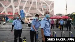 Қытайда вирус жұқтырғандардың қайта көбейе бастауы індет қайталана ма деген қауіпті өршітті